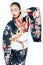 Young pretty real geisha in kimono with sakura and decoration on white background isolated