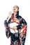 Young pretty real geisha in kimono with sakura and decoration on white background isolated