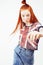 Young pretty red head teenage hipster girl posing emotional happy smiling on white background, lifestyle people concept