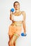 Young pretty slim blond woman with dumbbell cheerful smiling, measuring herself, diet people concept