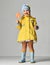 Young pretty toddler girl kid with big sweet lollypop candy in yellow jacket and rubber boots