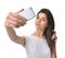 Young pretty woman make self portrait selfie with her cellphone