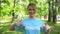 Young pretty woman pointing at volunteer word on blue t-shirt, eco activist