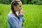 Young pretty Woman Praying Outdoors .