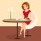 Young pretty woman sitting alone in the cafe and using a tablet pc