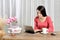 Young pretty woman work in home office