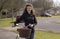 Young priest using a bicycle to visit her parish