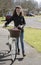 Young priest using a bicycle to visit her parish