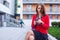 Young professional business woman sitting outdoor with computer