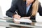 Young professional business woman working at desk