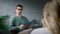 A young professional psychotherapist conducts an interview with a patient in the office