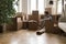 Young property buyer man sitting on parqueted heating floor