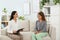 Young psychologist working with girl in office