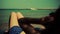 Young pure girl woman lying on beach of sea, wears