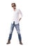 Young red hair male fashion model wearing ripped jeans white shirt and sunglasses