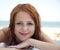 young red-haired girl on the beach
