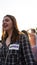 Young red head woman with in squares, chequered with sign Pride in her chess in the Sofia Pride festival