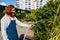 young redhaired ginger bearded man in apron working in the garden or plantation