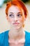 Young redhead beautiful freckled woman thinking