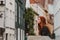 Young redhead girl rest on the street in Brugge