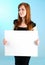 Young Redhead Woman Holding a Blank White Sign