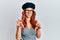 Young redhead woman wearing fashion french look with beret smiling funny doing claw gesture as cat, aggressive and sexy expression