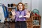 Young redhead woman working as manager at retail boutique afraid and terrified with fear expression stop gesture with hands,