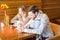 Young Religious Couple Saying Prayer Prior to Eating