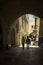 Young religious jews walking on ancient cobblestone alley in Old City of Jerusalem