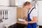 Young Repairman Checking Kitchen Extractor Filter