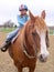 A young rider in the saddle