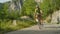 Young road biker speeding down the picturesque forest road on his new bicycle.