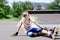 Young rollerblader taking a rest