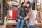 Young romantic couple sitting on the bench and admiring amazing nature