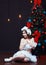 Young romantic woman in white christmas fancy dress