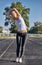 Young runner fit woman streching before exercises outdoors. Athletic female strech after workout outside. Sport and