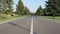 A young runner runs along the road along the golf course