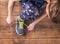 Young runner tying her shoes