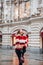 Young russian girl on the red Square through winter holiday in Moscow, stylish and beautiful posing near to Gum