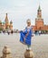 Young russian girl wearing traditional costume at Red square in Moscow