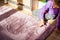 Young sad girl drawing two big hearts on the kids room carpet. Loneliness and child sadness, arguing at home, divorce in family