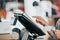 Young saleswoman doing process payment on the touchscreen POS, counting sale in the cash register, finance concept