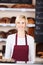 Young saleswoman working in bakery