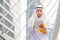 Young Saudi skilled professional engineer using tablet smartphone, Arab man Construction civil engineer at building construction