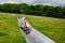 Young school kid boy having fun riding summer toboggan run sled down a hill in Hoherodskopf, Germany. Active child with