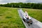 Young school kid boy having fun riding summer toboggan run sled down a hill in Hoherodskopf, Germany. Active child with