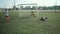 Young schoolboy football player resists friend attack