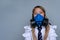 Young schoolchild in gasmask closeup portrait