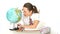 Young schoolgirl examining a world globe