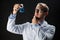 Young scientist holding test flask with chemical